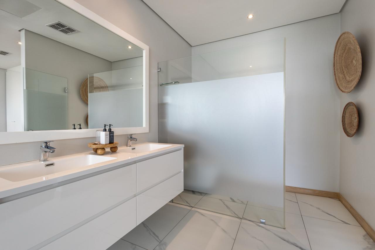 Whitefoord Beach House bathroom vanity and walk-in shower