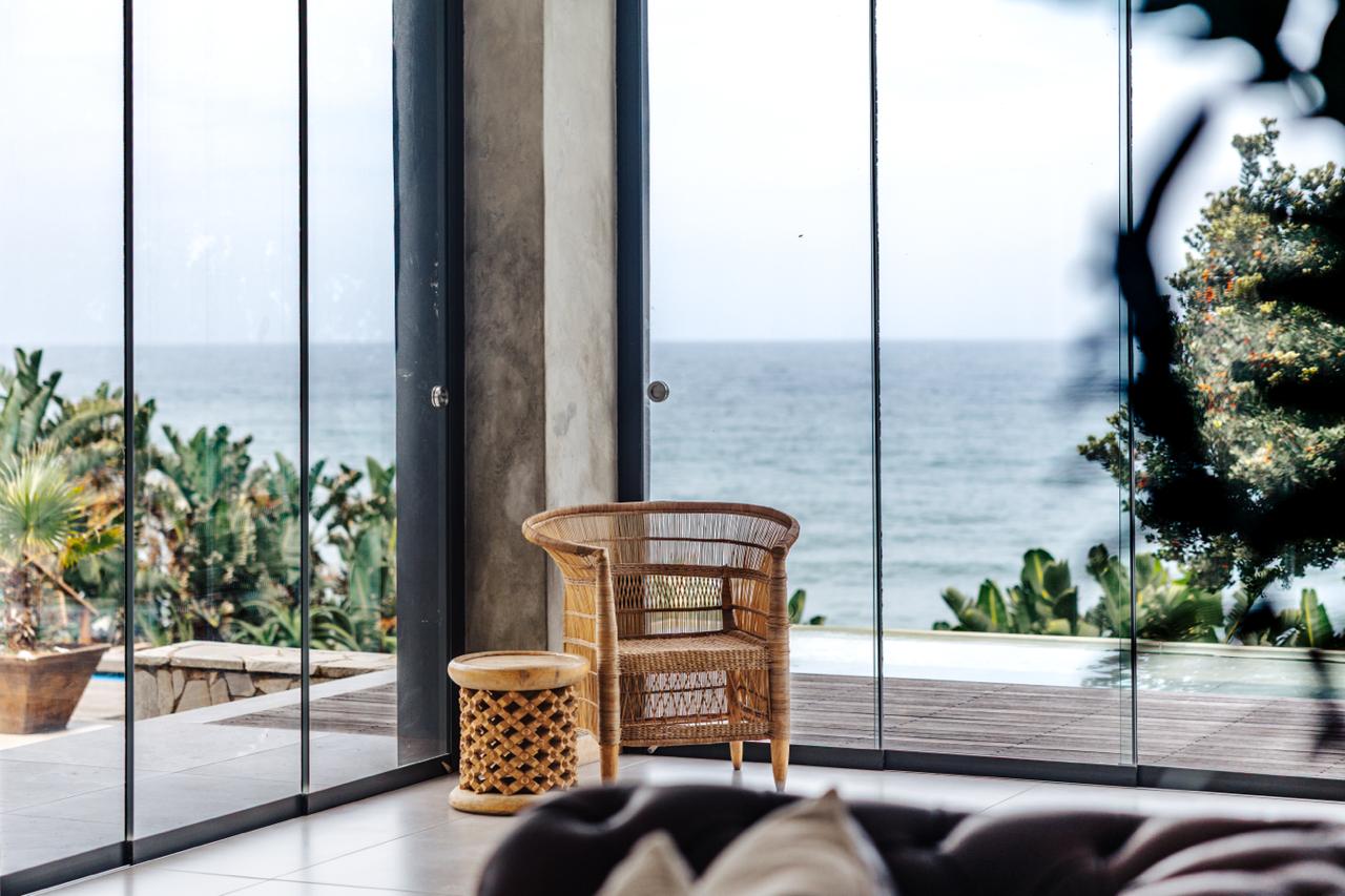 Whitefoord Beach House woven chair overlooking the ocean