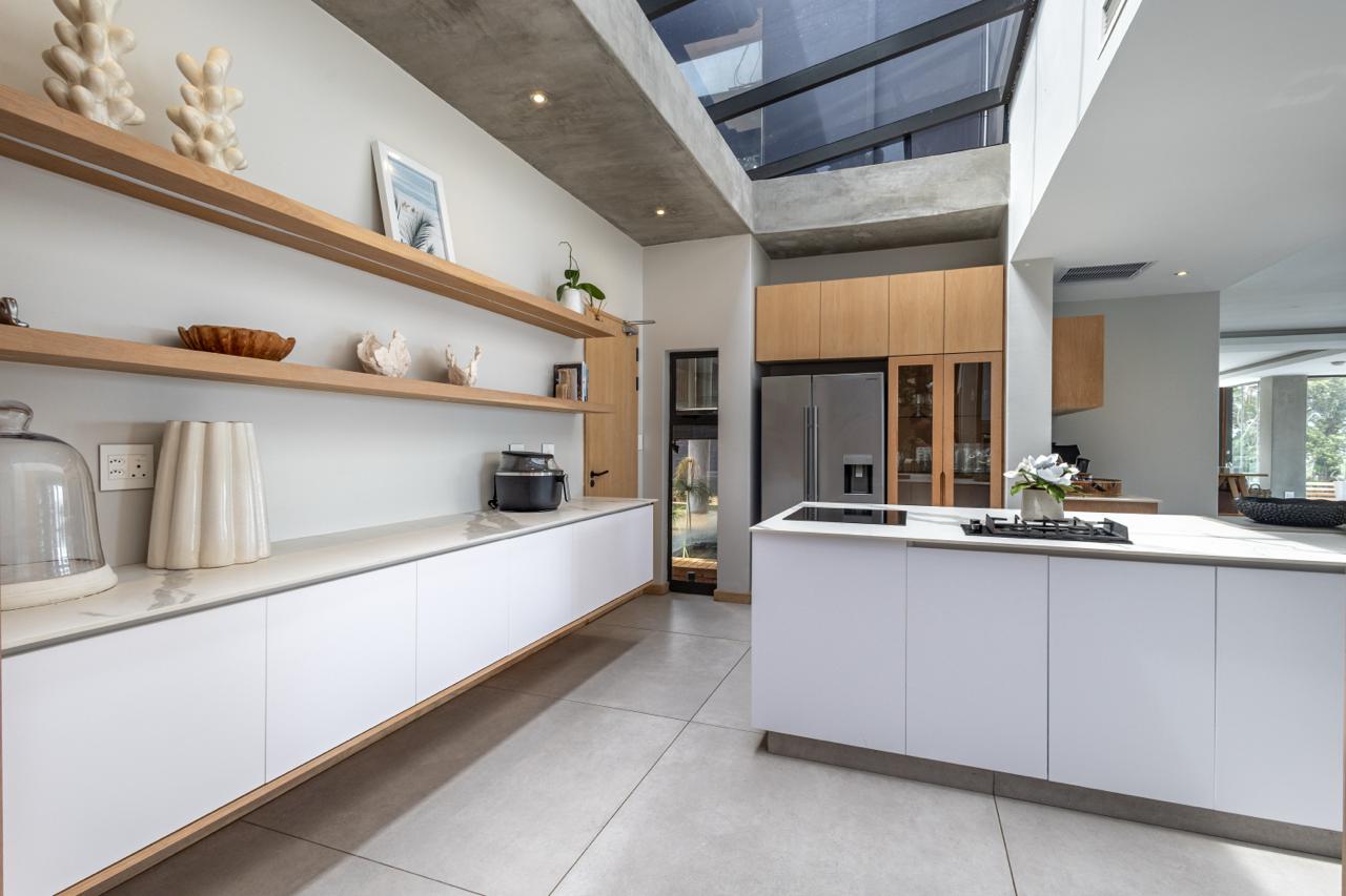 Whitefoord Beach House skylit kitchen with timber shelving